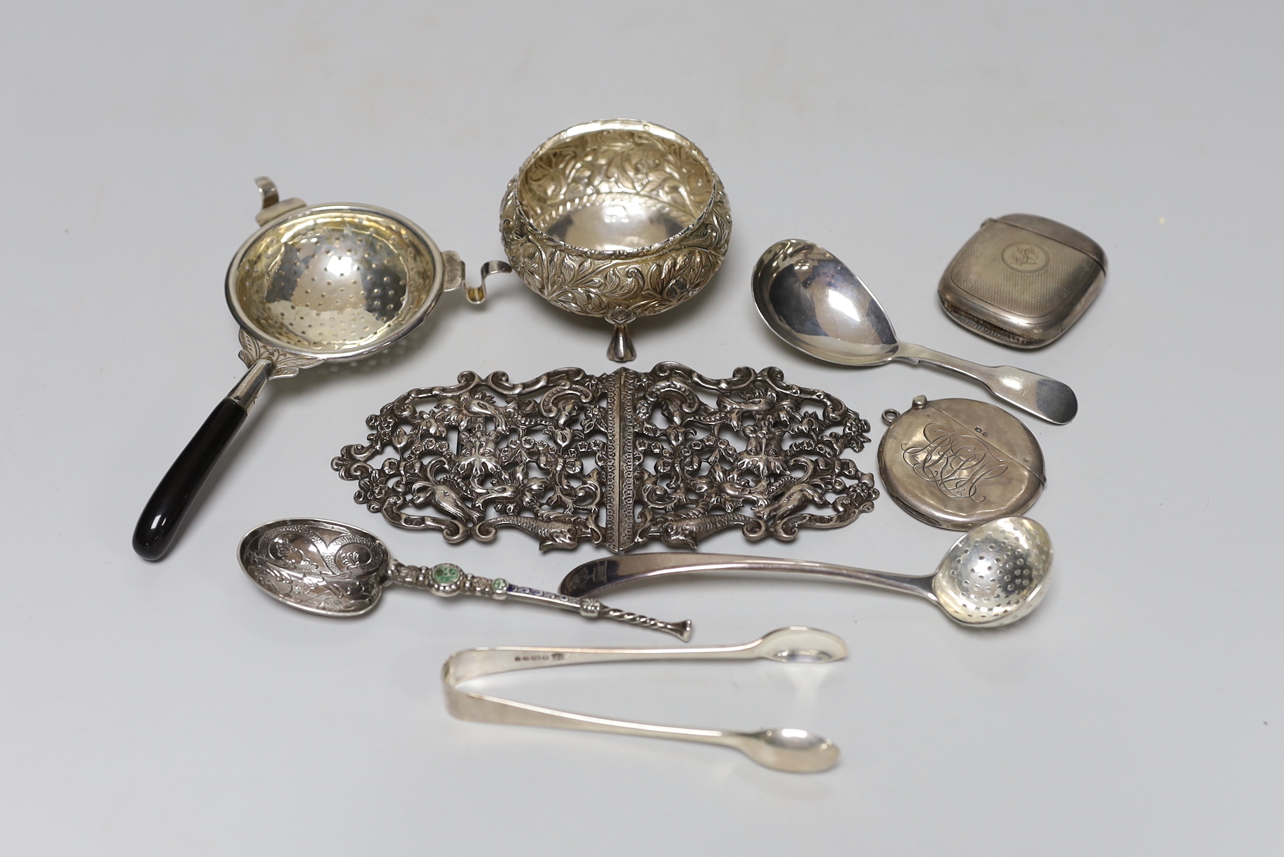 Sundry silver and white metal items including vesta cases, William IV caddy spoon, belt buckle, enamelled replica of the anointing spoon, etc.